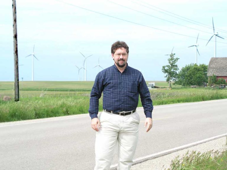 Me, in an Iowa cornfield surrounded by windmills.