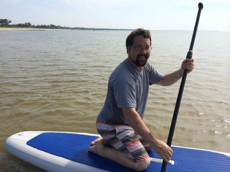 Me, on a stand-up paddleboard in the Gulf of Mexico. (I never got very good at standing.)