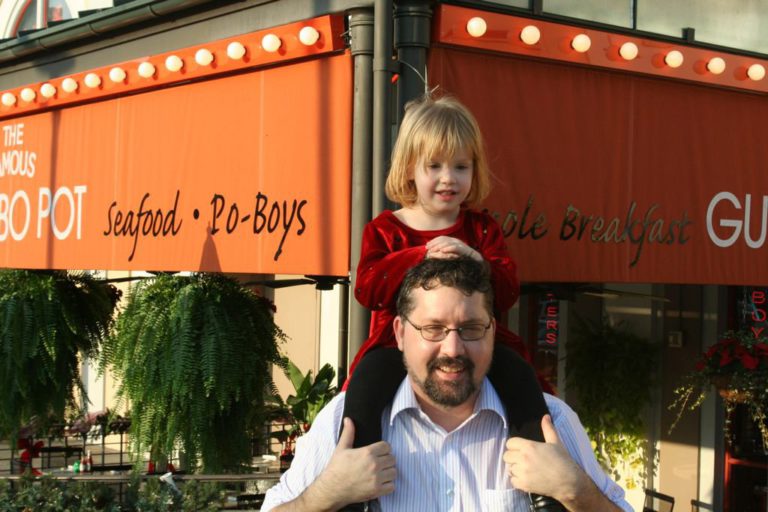 Carrying Q piggyback during a long day in the New Orleans French Quarter.