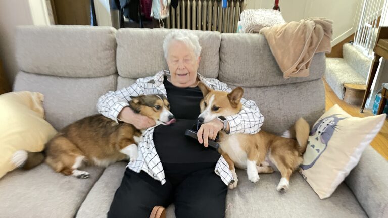 Jan Sauer, cuddling our two dogs on the couch.