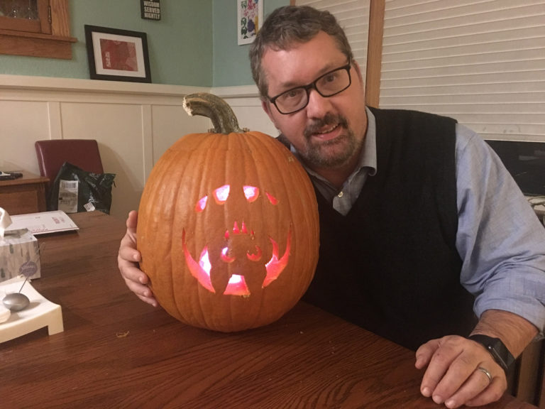 Carving a Halloween pumpkin.