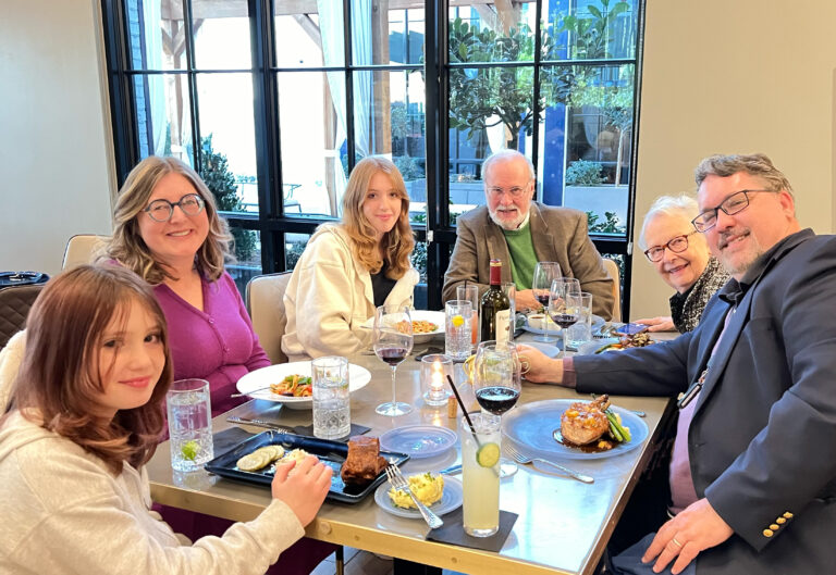 The family, dining together.