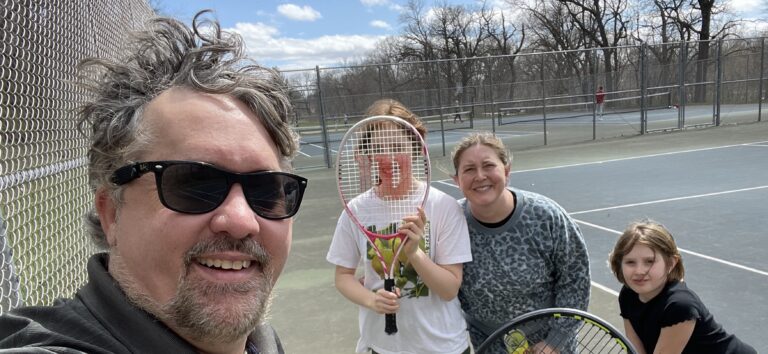 Us, playing family doubles tennis at Brookside Park.