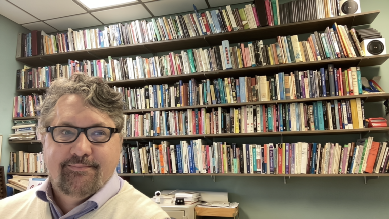 Me, in my old ISU office with my books arrayed behind me.