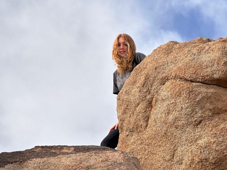 Quinn, climbing rocks at Joshua Tree.