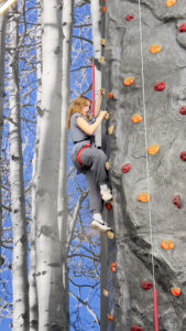Climbing a rock wall in Lubbock.