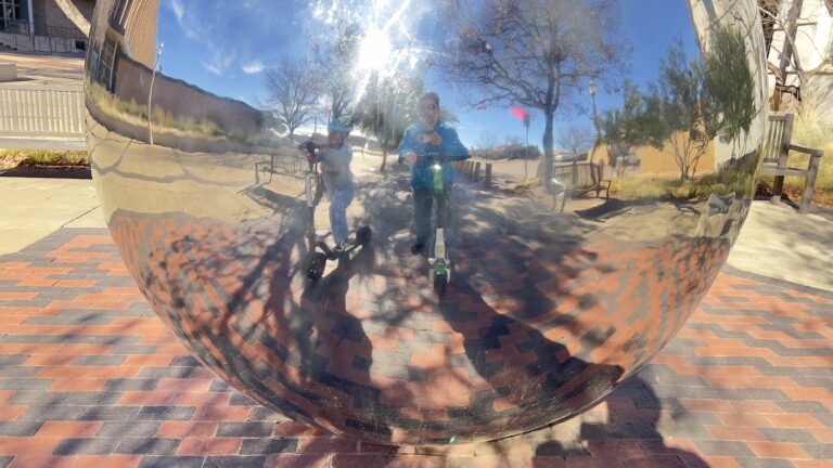 Charlie and me on scooters, on the TTU campus.